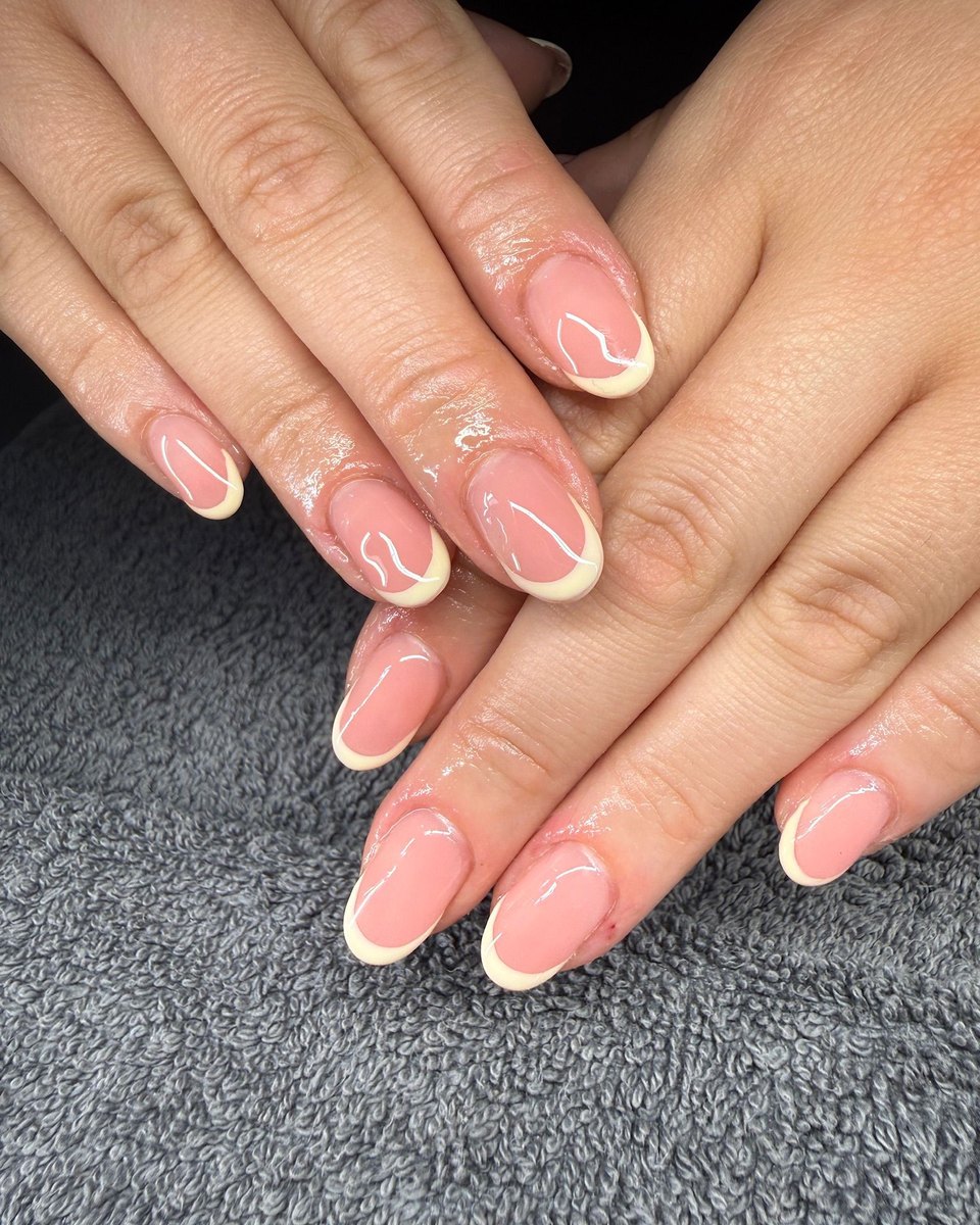 A set of BIAB nails in a soft nude